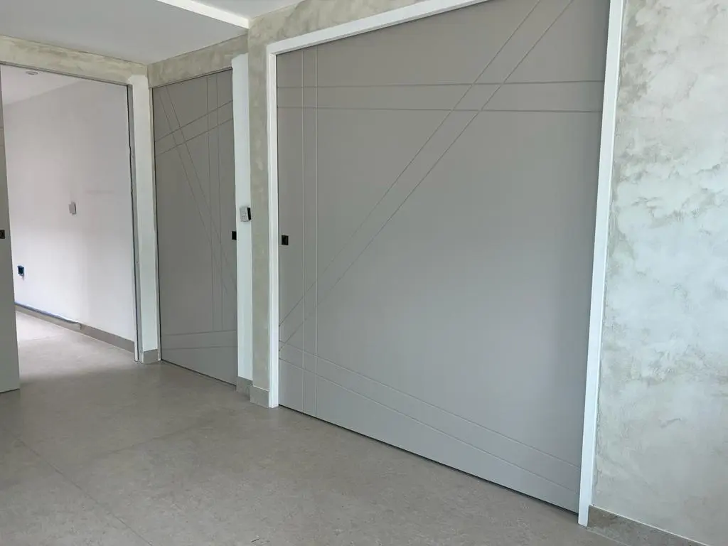 Painted sliding modern pocket doors being installed bespoke doors internal