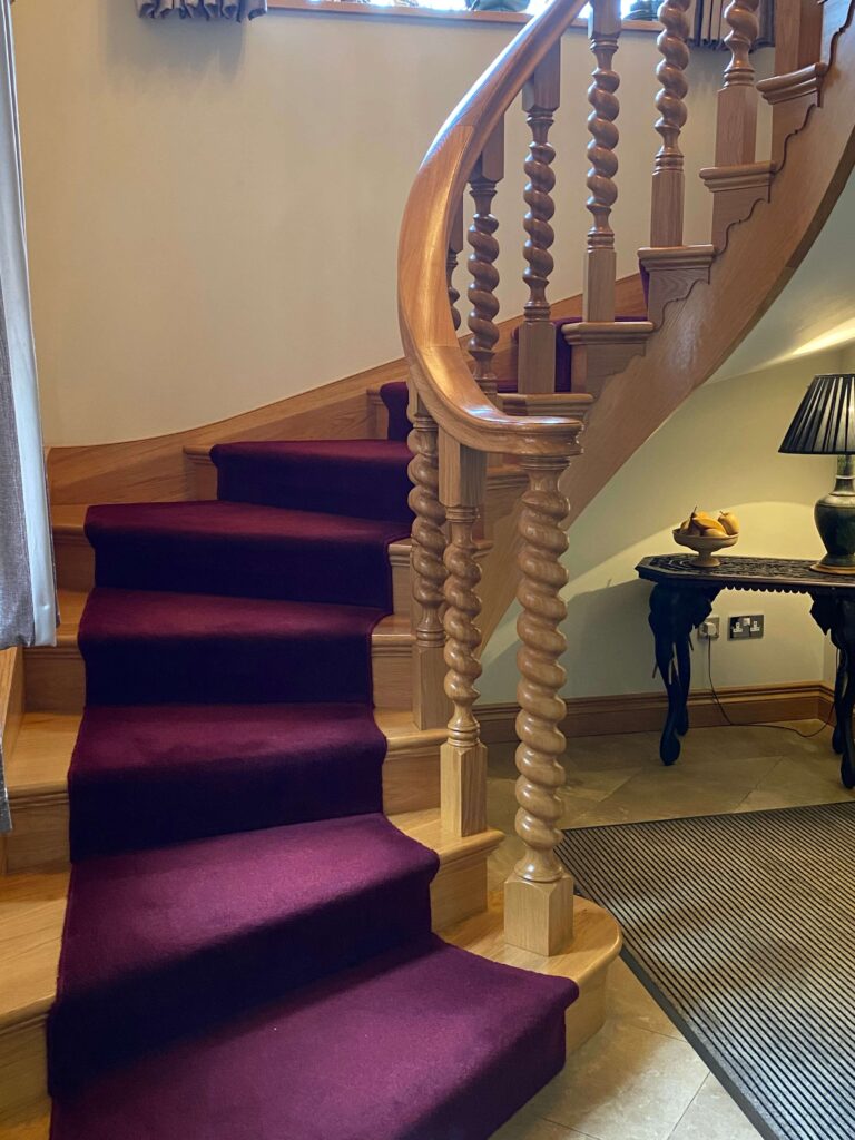 Oak cut string stair with heavy section turnings luxury modern curved staircase