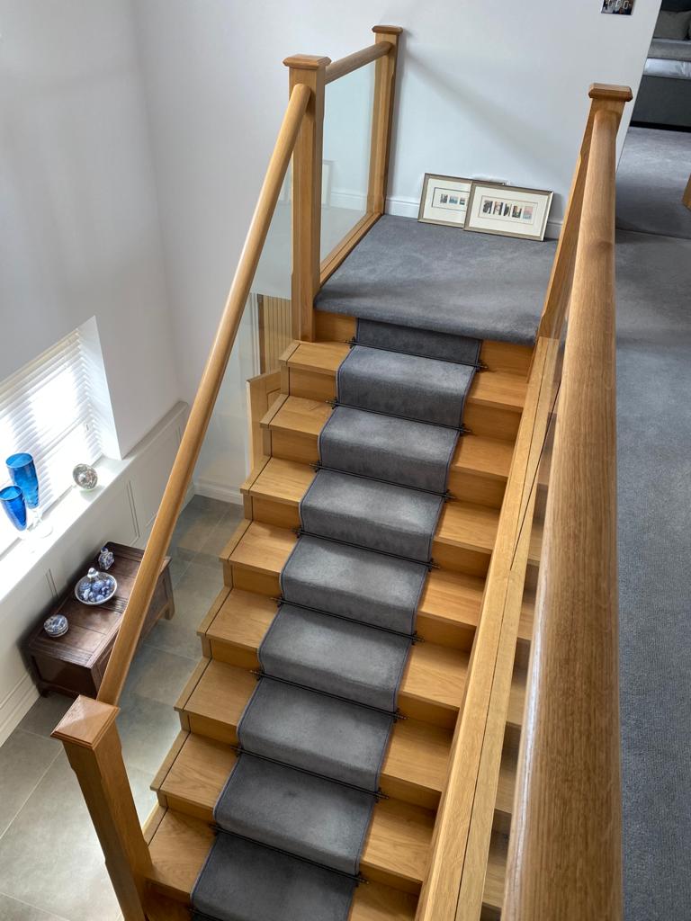 Oak closed string stair with glass balustrade and oak handrail modern contemporary staircase